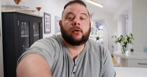 4K Cheerful overweight man having a conversation on video call Stock Footage 88624127