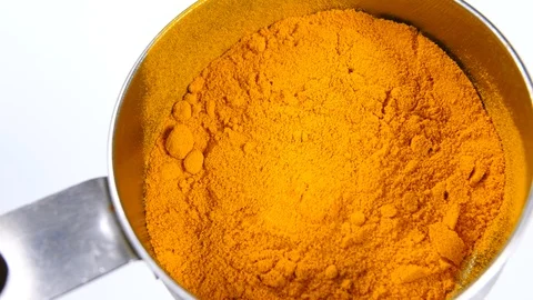 4K chef checking Yellow Turmeric on white surface background in cup utensil Stock Footage 88479714