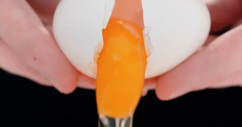 4K - Chef cracking an egg. Close-up Stock Footage 107008652