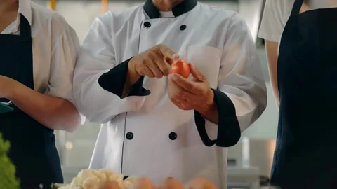 4K Chef Pointing at Red Tomato for Ingredient Inspection or Instruction Stock Footage 332157751