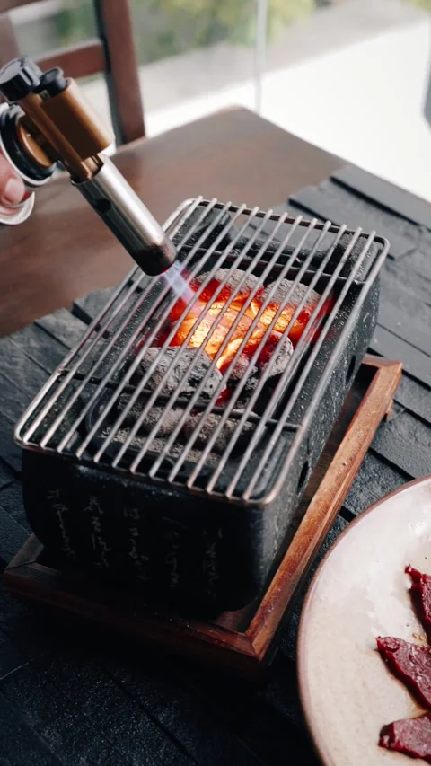 4K chef using torch charcoal for table asian bbq - vertical video Stock Footage 314682827