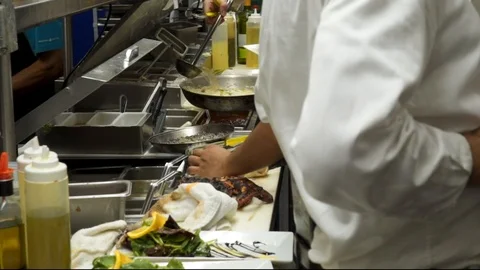 4k Chef's working in restaurant kitchen slow mo Stock Footage 122937908