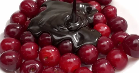 4K - Cherry covered with liquid chocolate Stock Footage 248773998