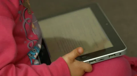 4K Child hands playing with tablet Stock Footage 47699378