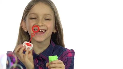 4K Child Playing Soap Bubbles, Happy Smiling Girl Blowing Balloons, White Screen Stock Footage 72379943