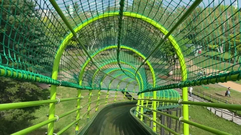 4K Child's POV Sliding Down from a Long Slide at a Park in Hokkaido Stock Footage 140340604