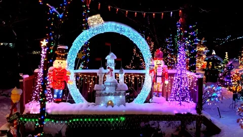 4K Christmas magic castle lighted display, walking bridge over stream Stock Footage 121126323