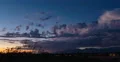 4K Cine 24p dusk stray storm cell heads over mountains colorful time lapse 4k or 4k+ Resolution