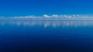 4K Cinemagraph Of Deep Blue Lake Rippled And Clouds Moving Across Sky Stock Footage
