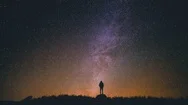 4K Cinemagraph Of Man Star Gazing In Wonder At Night Sky Stock Footage