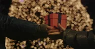 4K Cinemagraph Of Present In Front Of Christmas Tree Stock Footage