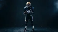 4K Cinemagraph - Seamless Loop. Portrait Of American Football Player With A Ball Stock Footage