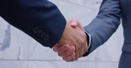 4K Cinemagraph: Slow Motion Of Senior Businessmen Shaking Hands Stock Footage