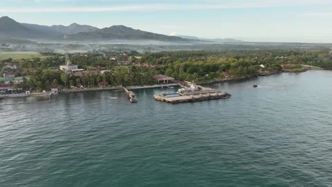 4K Cinematic Aerial Pan Pull Back of Coastal Landscape with Ocean and Mountain V Stock Footage 331488278