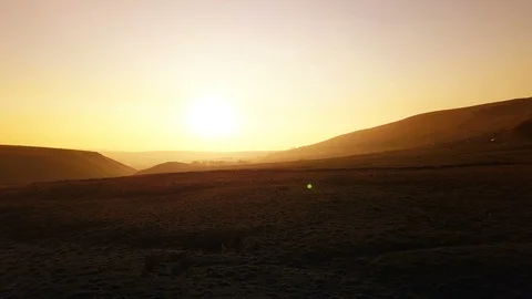 4k Cinematic aerial pull back reveal of sunset fields and countryside Stock Footage 106381216