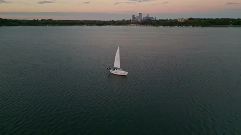 4K Cinematic Aerial View Orbit Of Sailboat On Lake Calhoun Minneapolis Sunset Stock Footage 220469722