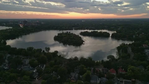 4K Cinematic Aerial View Orbit Of Lake Lake Of The Isles At Sunset Minneapolis Stock Footage 220469745
