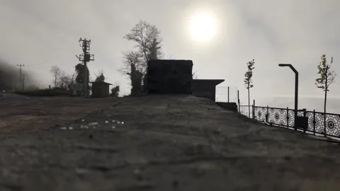 4K Cinematic Camera Starts Moving Toward a Foggy Coastal Road at Sunset Vídeos de archivo 339215846
