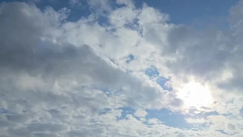 4K Cinematic Clouds Timelapse with Bright Sun Stock Footage 332394198