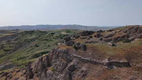 4K Cinematic Drone Flight Over Mountain Landscape Toward Distant Mosque Video stock 336262641