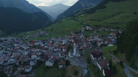 4K cinematic drone flight toward Nauders church in Tyrol Austria Stock Footage 340776761