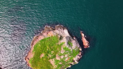 4K Cinematic Drone Orbit Descent Over Green Island, Slow Spiral Movement Stock Footage 334327385