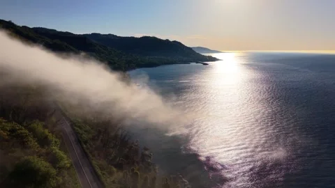 4K Cinematic Drone Pullback and Ascending Reveal Above Foggy Lighthouse Coast Stock Footage 339269440
