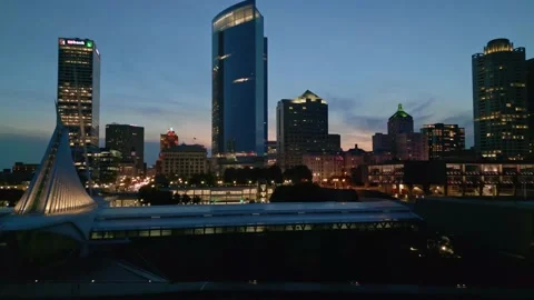 4K Cinematic Drone Shot Forward Ascending Toward Milwaukee Skyscrapers Blue Hour Stock Footage 220469388