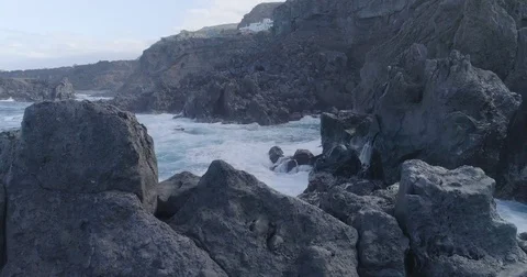 4k cinematic drone shot of oceanic beautiful waves crashing rocks Stock Footage 83873677