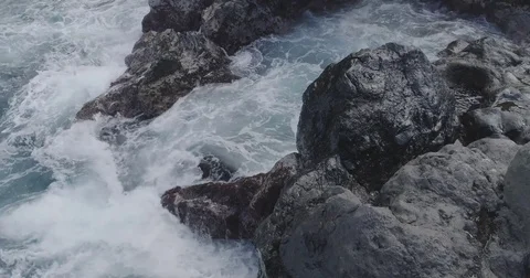 4k cinematic drone shot of powerful ocean waves crashing rocks Stock Footage 83874987