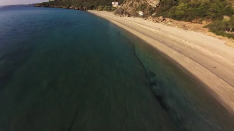 4K Cinematic FPV Drone Flight - Cliffs and Sandy Beach Sithonia Greece at Sunris Stock Footage 330500775