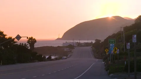 4K Cinematic Ground-Level Sunset on Malibu&amp;#039;s Iconic Pacific Coast Highway Stock Footage 316794800