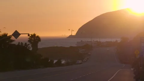 4K Cinematic Ground-Level Sunset on Malibu&amp;#039;s Iconic Pacific Coast Highway Stock Footage 316794805