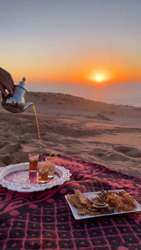 4K+ Cinematic Moroccan Mint Tea Pouring at Sunset in Sahara Desert Dunes Morocco Video stock 327851770