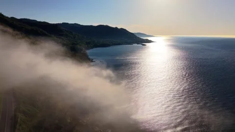 4K Cinematic Pull Back Shot of Foggy Lighthouse Coast at Sunset Stock-Footage 339268499