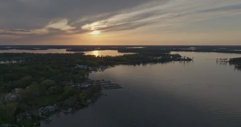 4K Cinematic Reverse Aerial View of Echo Bay Lake Minnetonka At Sunset Stock Footage 247873500