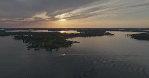 4K Cinematic Reverse Aerial View of Echo Bay Lake Minnetonka On A Spring Evening Stock Footage 247874787