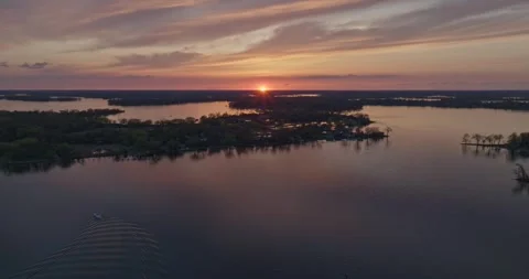 4K Cinematic Reverse Aerial View of Sunset On Lake Minnetonka Spring Evening Stock Footage 247875916