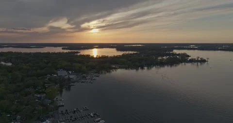 4K Cinematic Reverse Drone Shot of Echo Bay Lake Minnetonka At Sunset Stock Footage 247873034