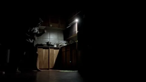 4K Cinematic Slow Motion Man in Hoodie Boxing Training in a Dark Kitchen Stock Footage 338171190