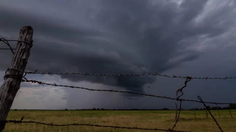 4K Cinematic Supercell Storm Behind Barbed Wire Timelapse - Prores Stock Footage 319857977