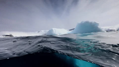 4K Cinematic View of Massive Icebergs Floating in Polar Ocean Waters Stock Footage 327409236