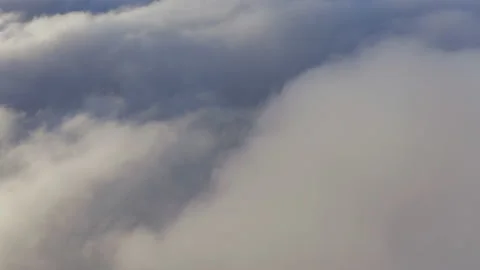 4K circular aerial flying over beautiful clouds in magical golden morning light Stock Footage 135486629