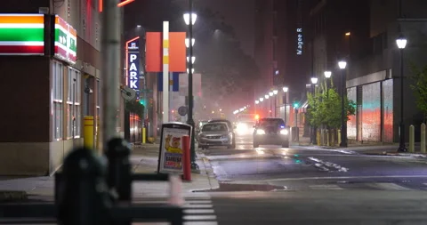 4K CITY STREET WITH AMBULANCE IN BACKGROUND Video stock 131126341