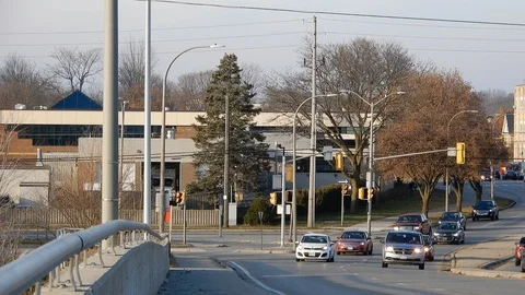 4K City Traffic Going Over Bridge During Sunday Afternoon Stock Footage 89110302