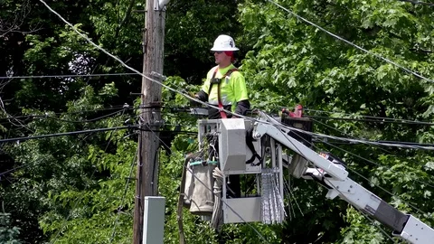 4K City utility worker inspects telephone pole electrical wires 스톡 동영상 110703049