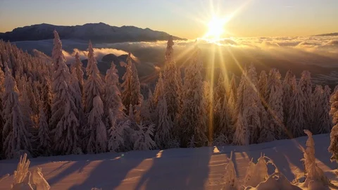 4k clip with sunset over a mountain landscape in winter season 스톡 동영상 122223891