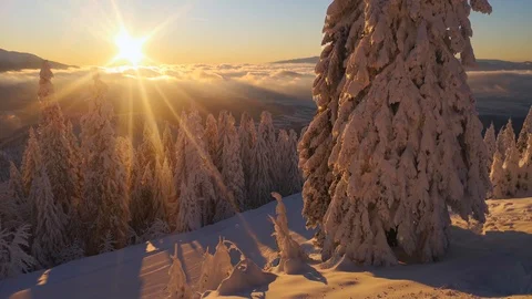 4k clip with sunset over a mountain landscape in winter season 스톡 동영상 122223904