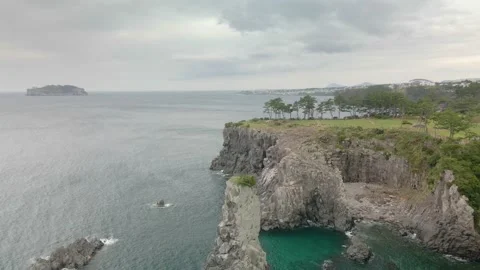 4K Clockwise Drone Shot of Ohoedolgase (외돌개), Jeju Island Stock Footage 143863742