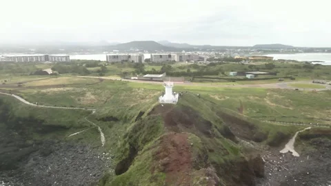 4K Clockwise Drone View around Seopjikoji's (섭지코지) Famous Lighthouse Stock Footage 143864009